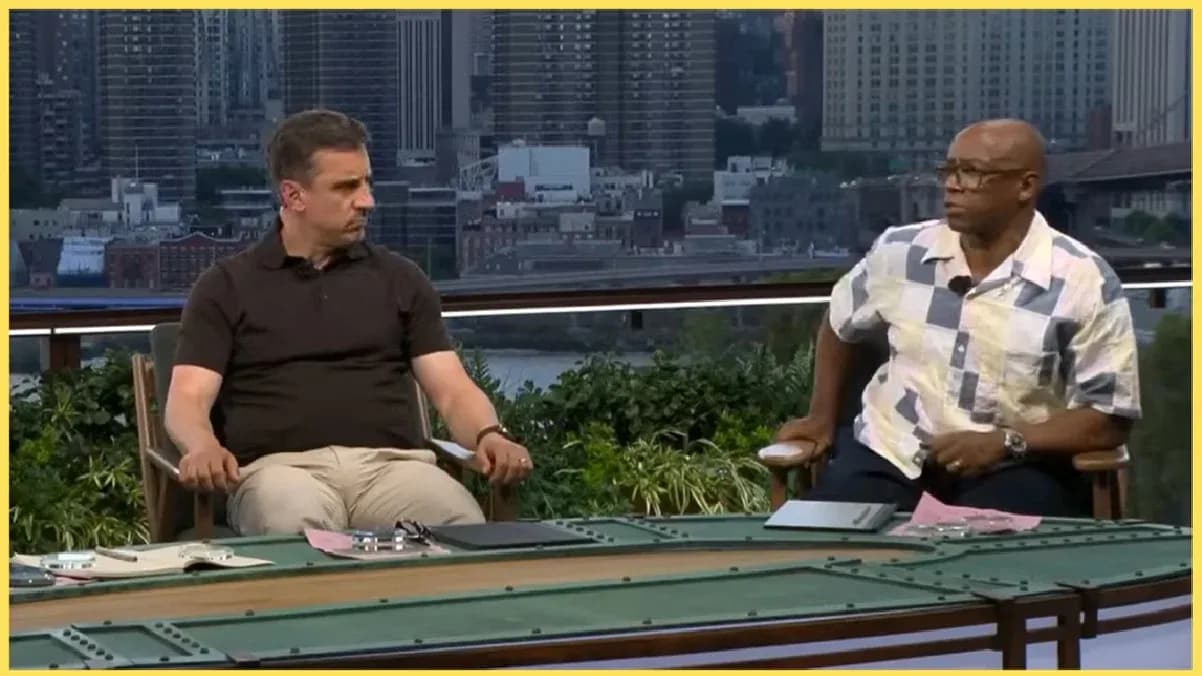 Two analysts discussing at a sports studio table