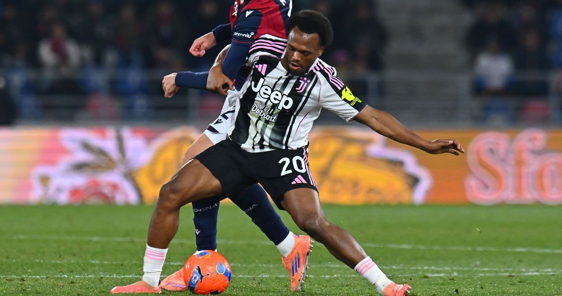 Juventus player tackling opponent during match