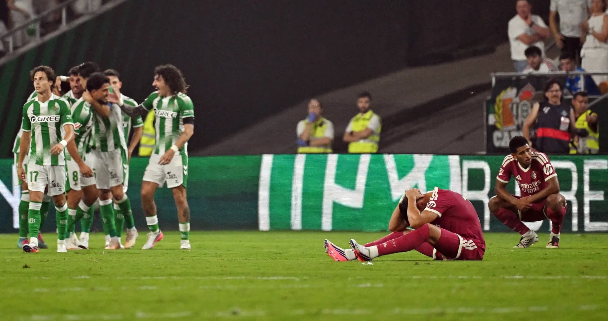 Players reacting during a tense moment in match