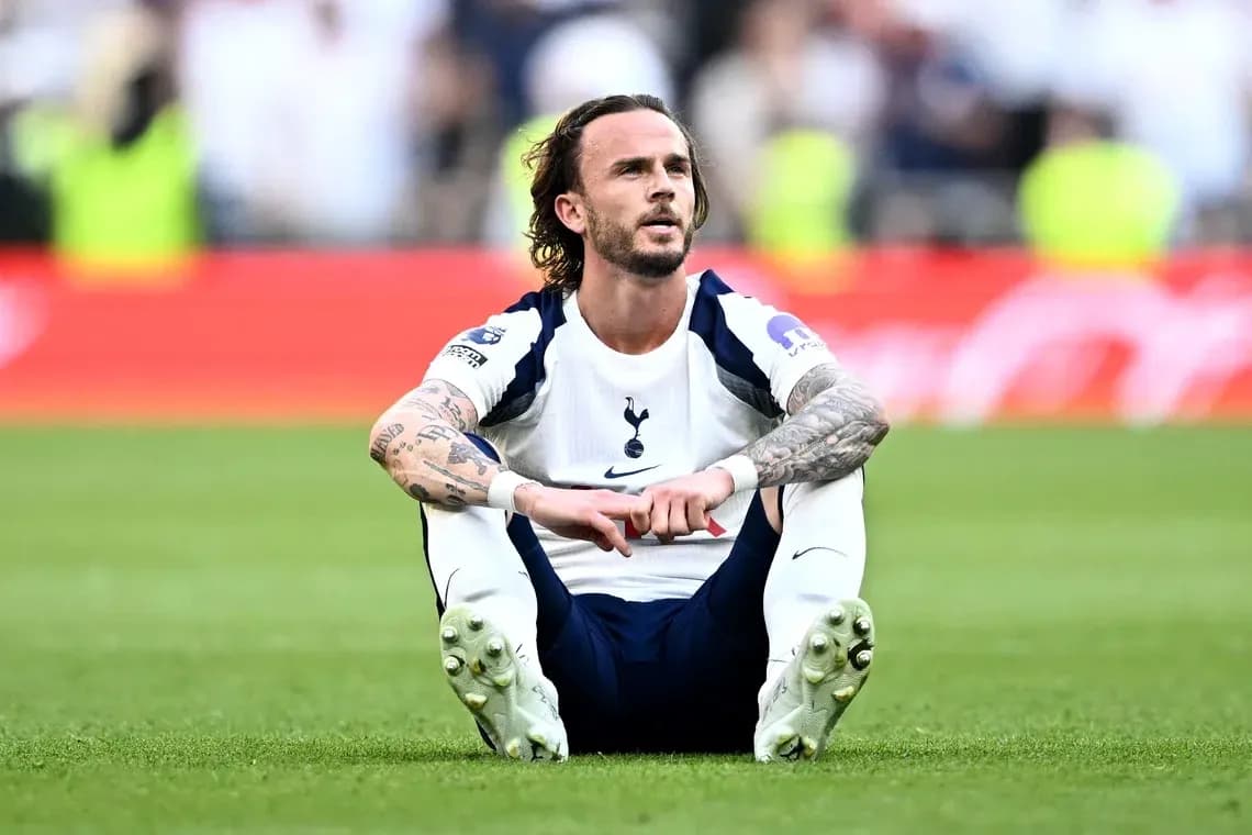 Tottenham player sitting on pitch after match
