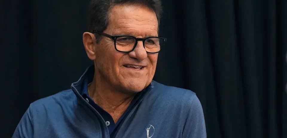 Man in blue shirt smiling at event