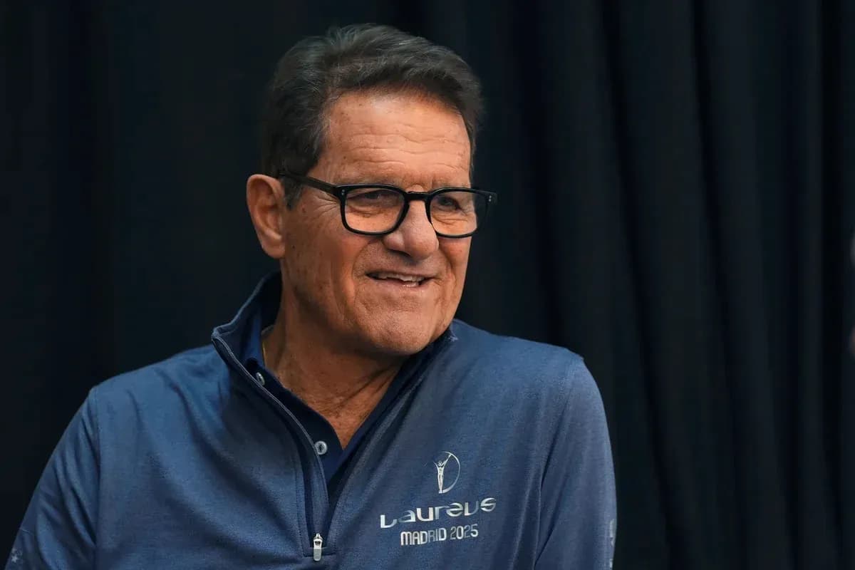Man in blue shirt smiling at event