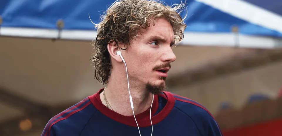 Athlete wearing headphones, looking off-camera