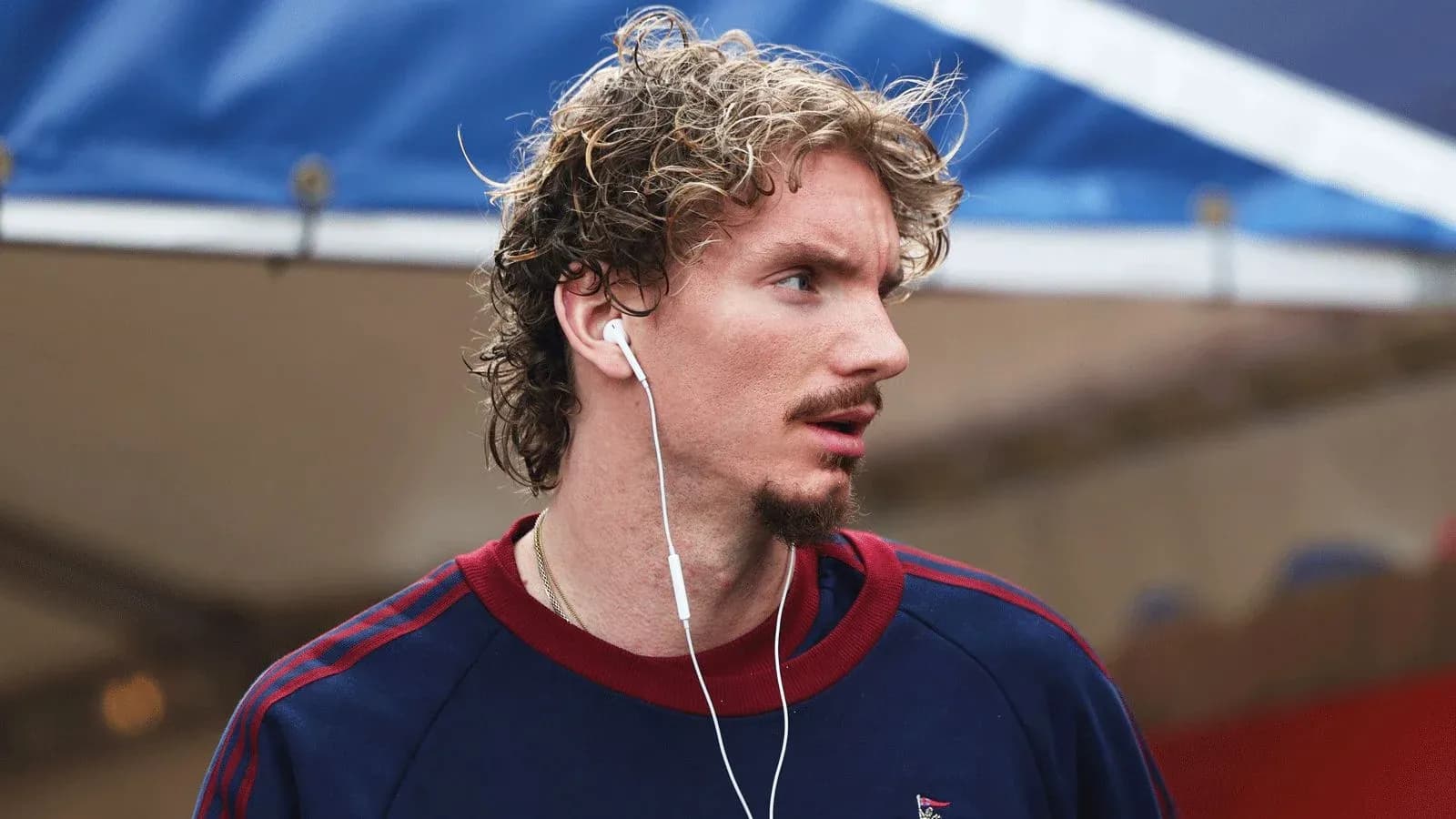 Athlete wearing headphones, looking off-camera