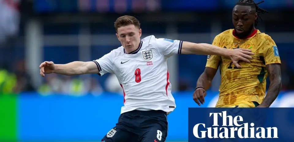 England player tackling Ghana player during match