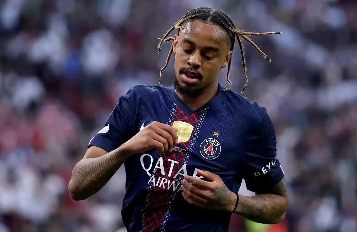 PSG player adjusting his medal after match
