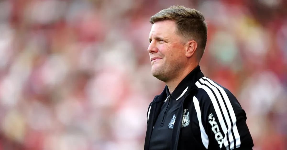 Men's football coach on sidelines during match