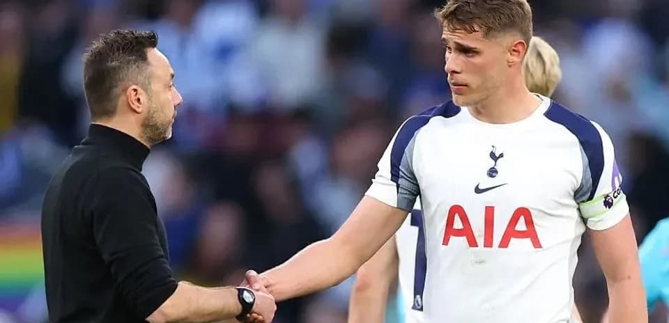 Tottenham player shaking hands with coach after match