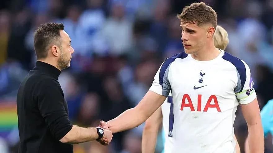 Tottenham player shaking hands with coach after match