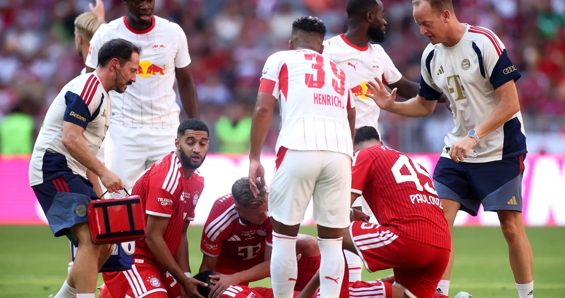 Medical staff attending to injured player during match