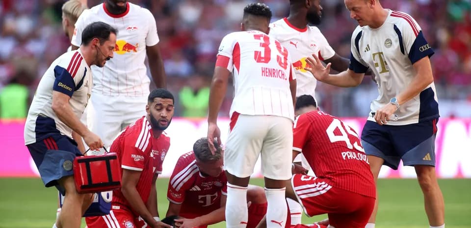Medical staff attending to injured player during match