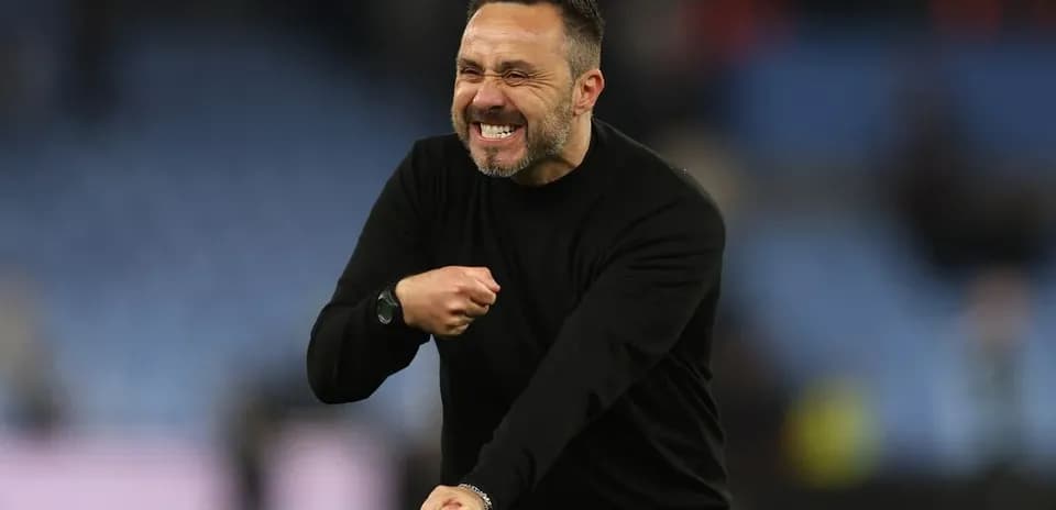 Coach celebrating passionately during a match