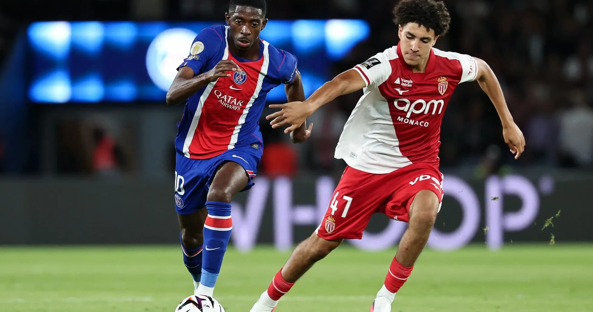 PSG player dribbling past Monaco defender during match
