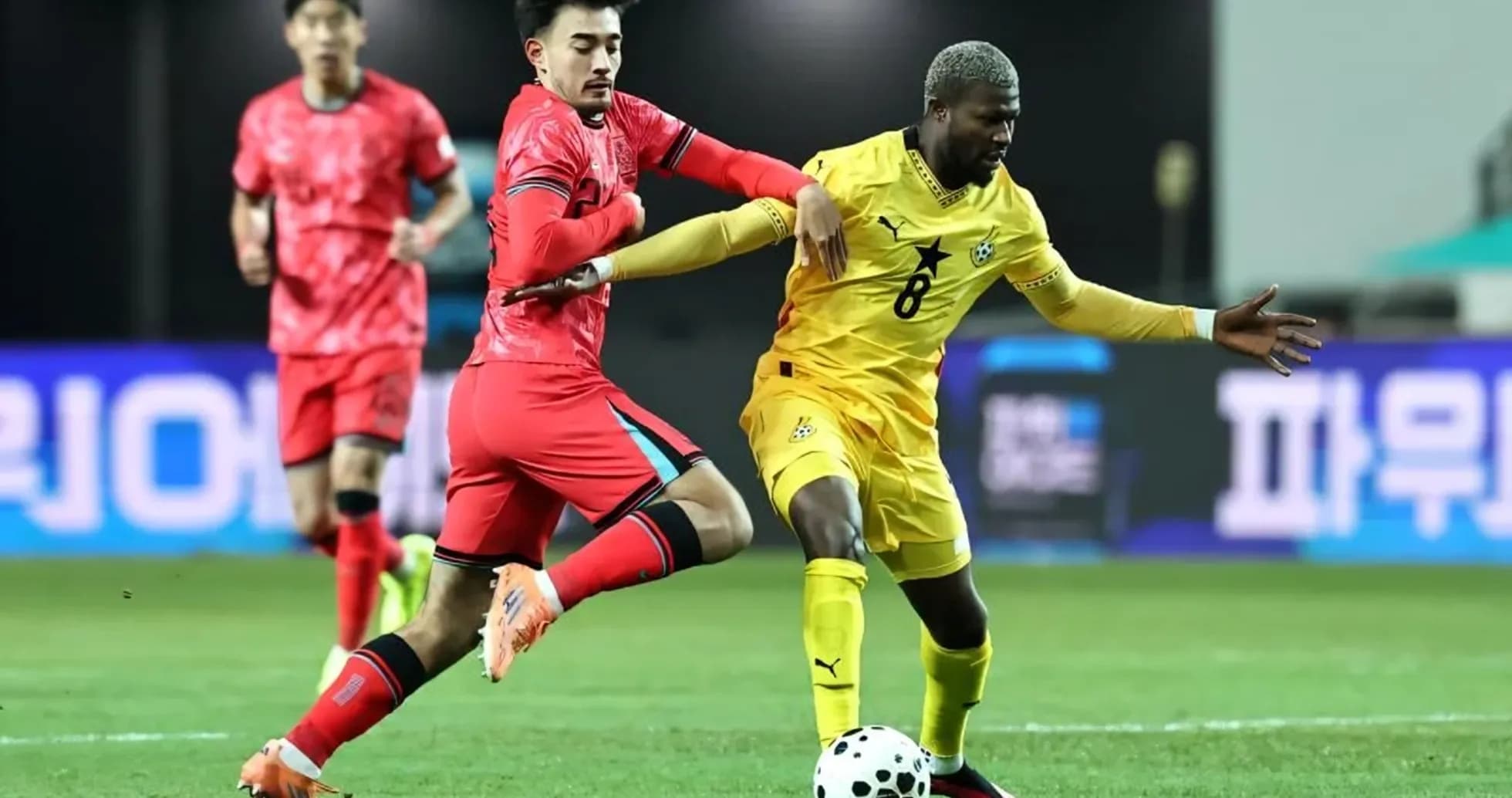 Ghana and South Korea players battling for the ball