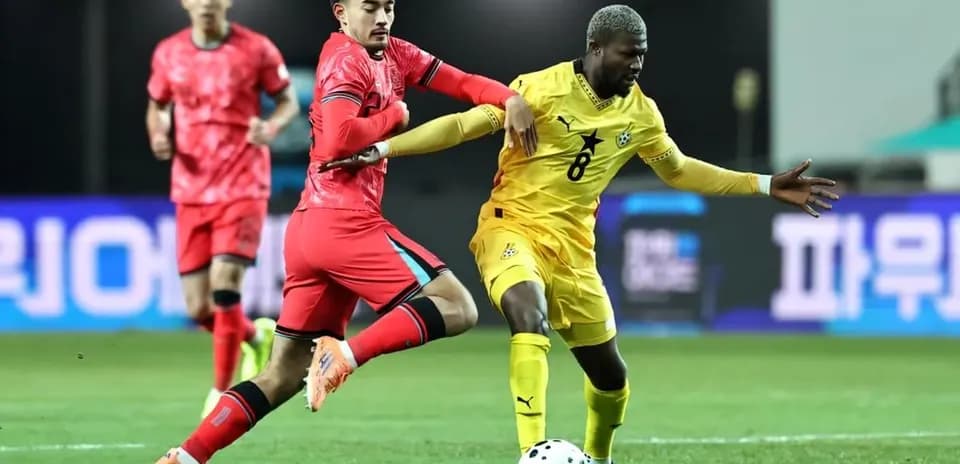 Ghana and South Korea players battling for the ball
