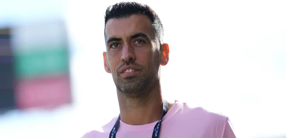 Player wearing a pink shirt with lanyard