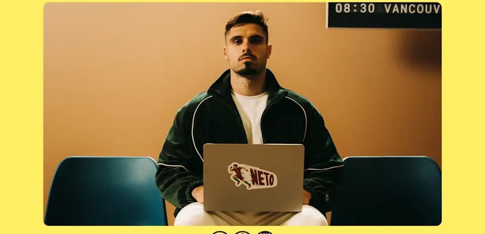 Person sitting with laptop in a waiting area