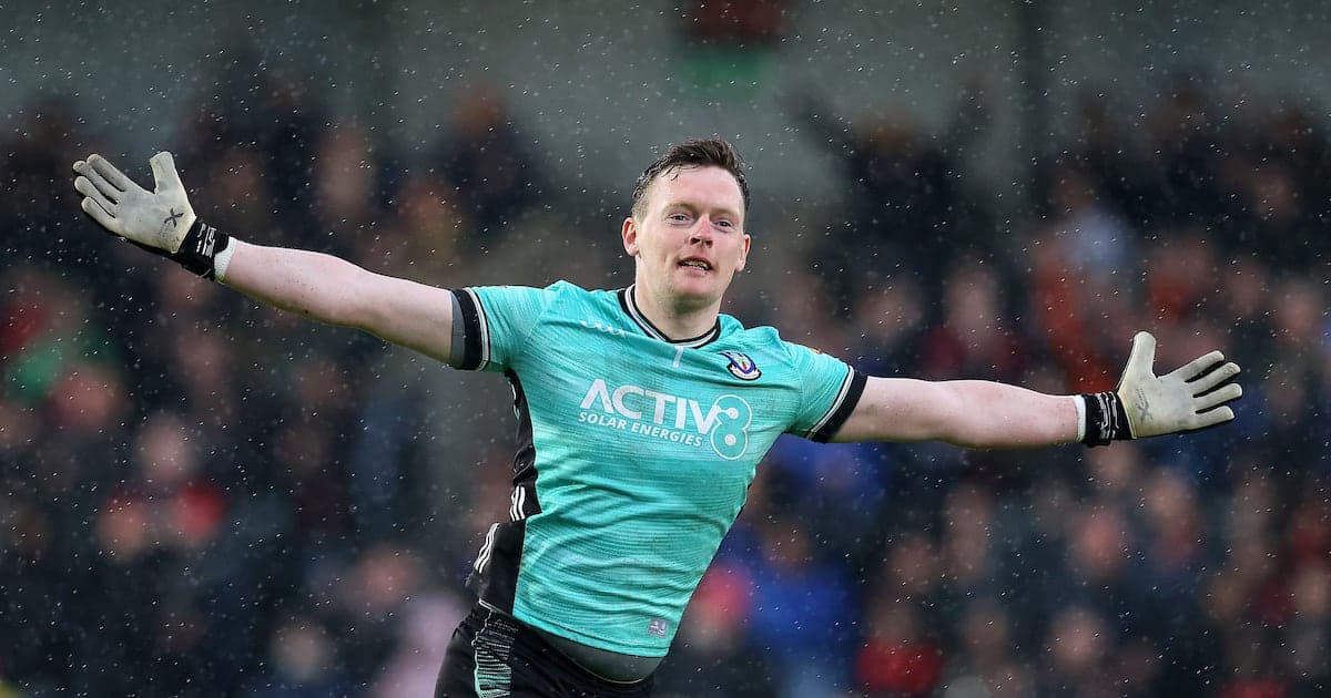 Goalkeeper celebrating during a match in rain