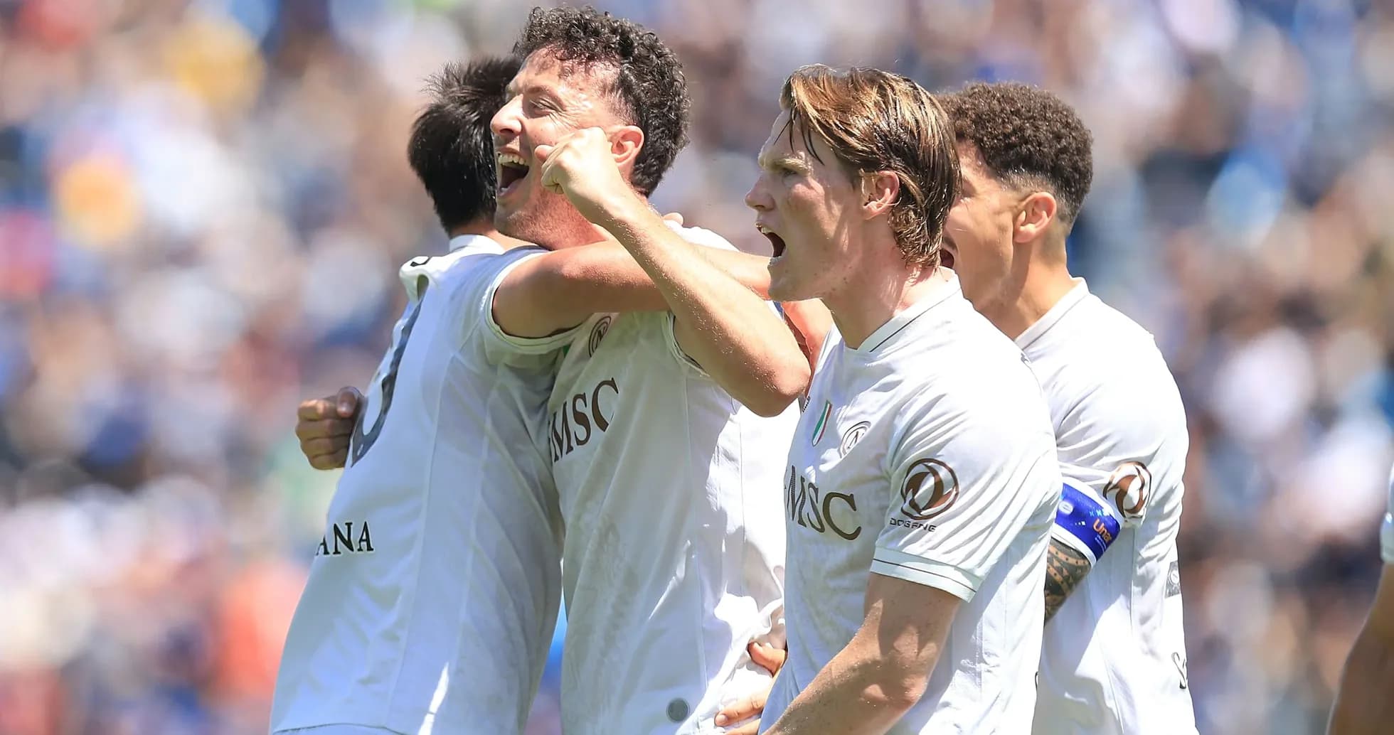 Players celebrating a goal during a match