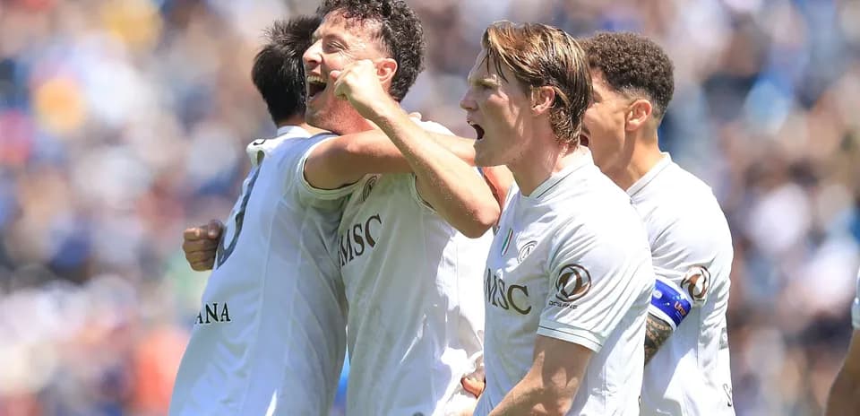 Players celebrating a goal during a match