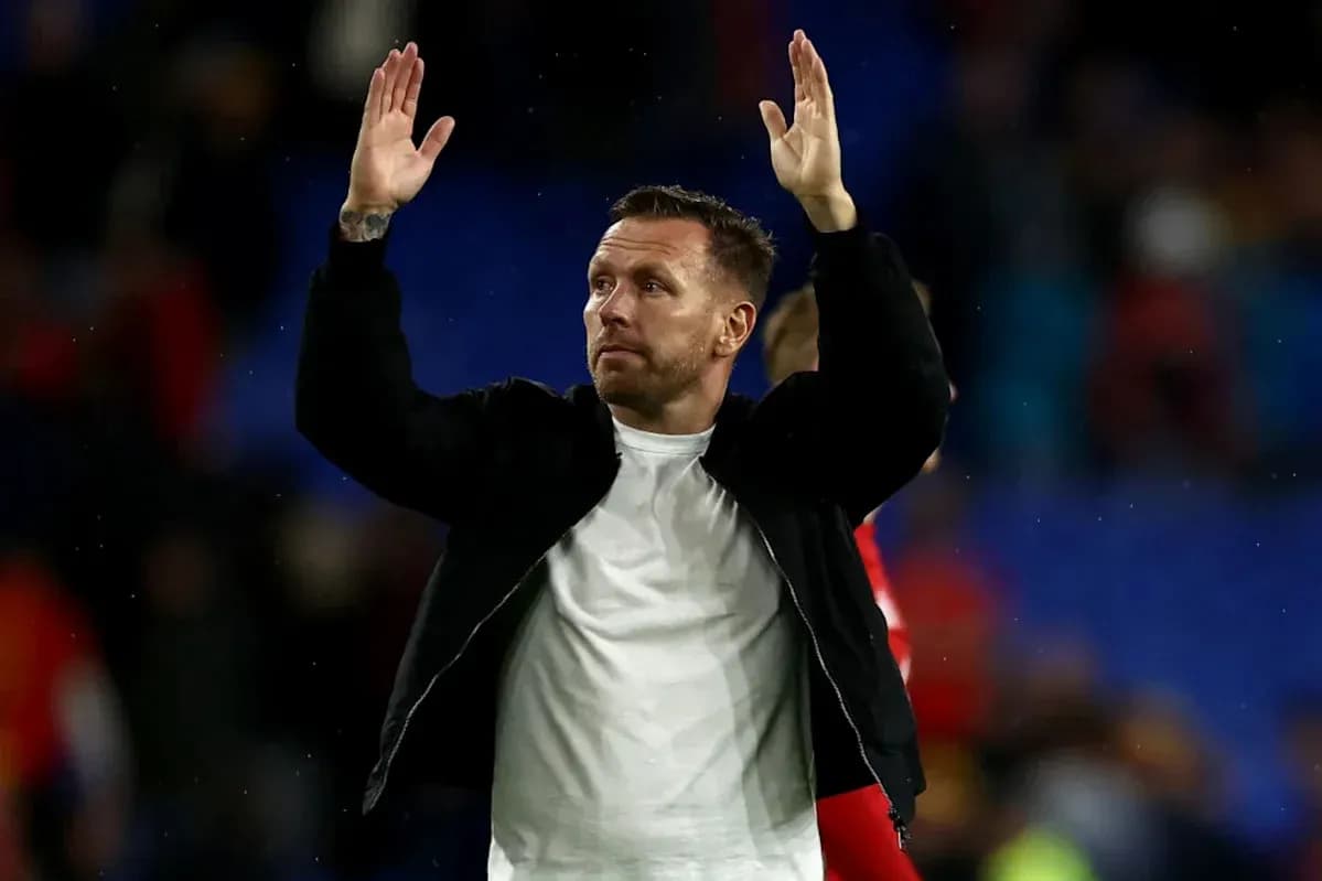 Man waving to crowd after a match