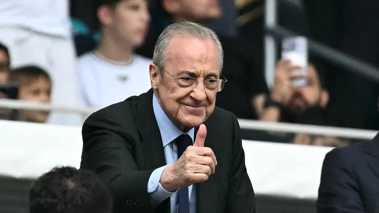 Person giving a thumbs up in stadium