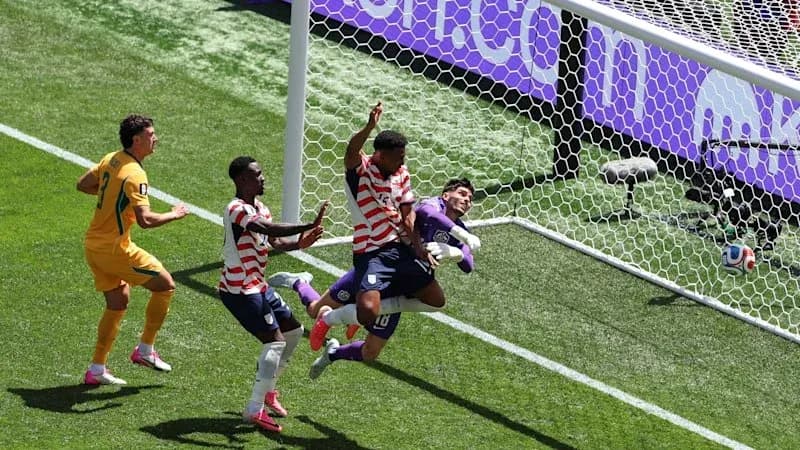 Players competing near the goal during match