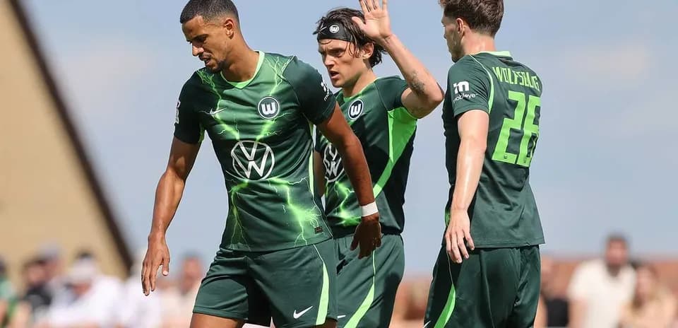 Wolfsburg players celebrating a goal during match