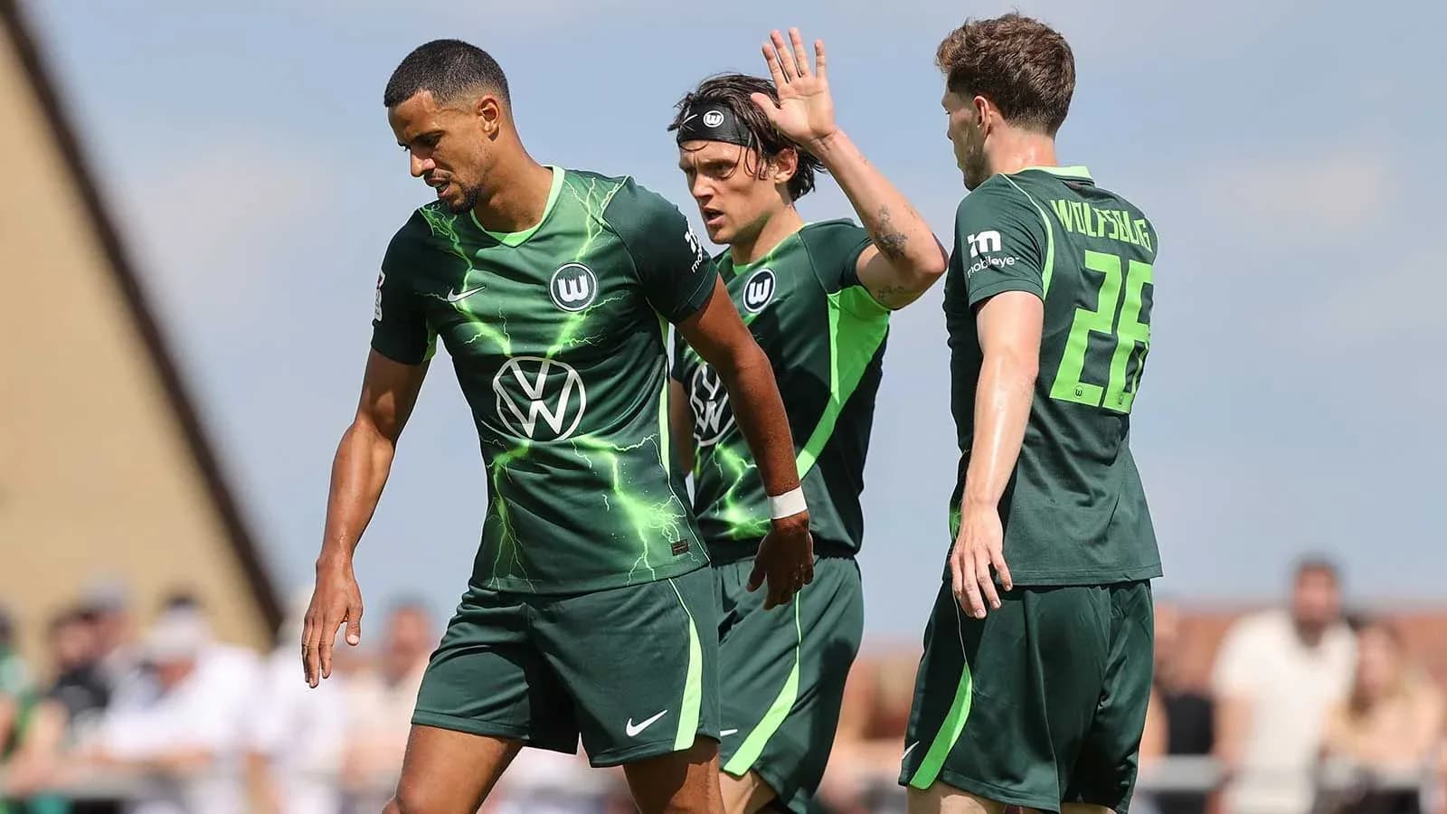 Wolfsburg players celebrating a goal during match