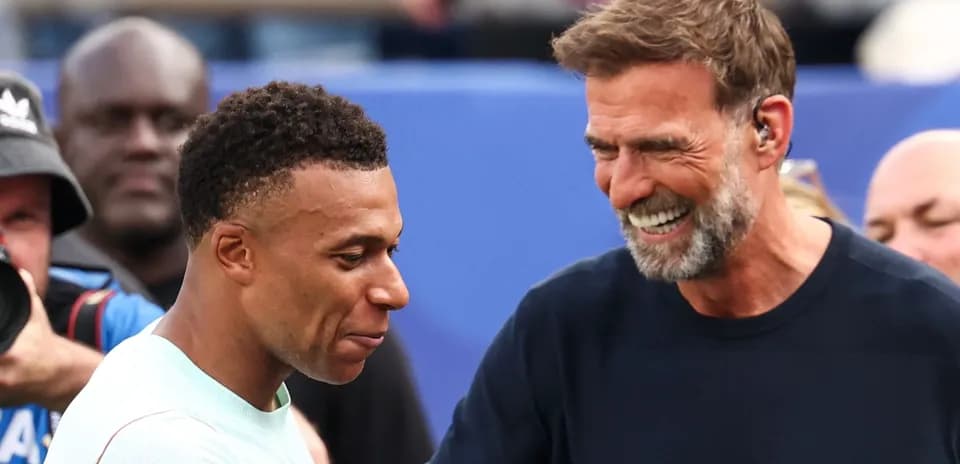 Two men smiling and interacting at event