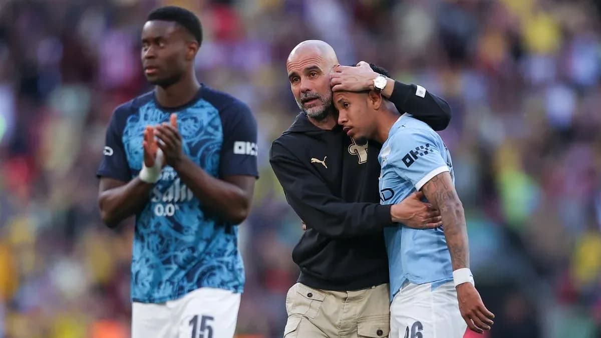 Pep Guardiola comforting player after the match