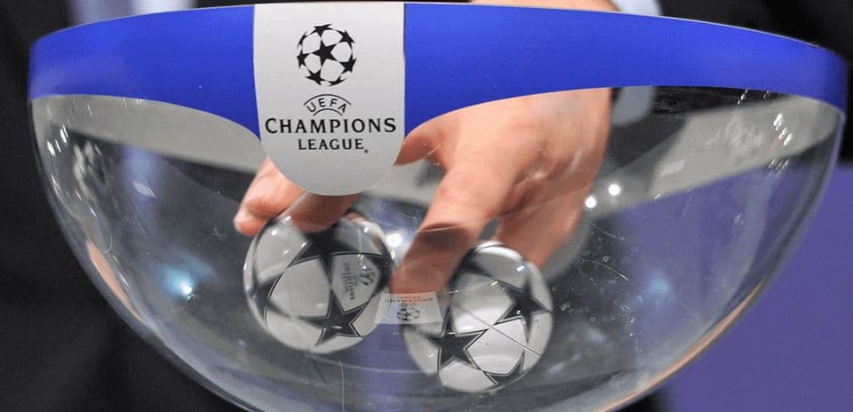 Hand drawing balls from UEFA Champions League bowl