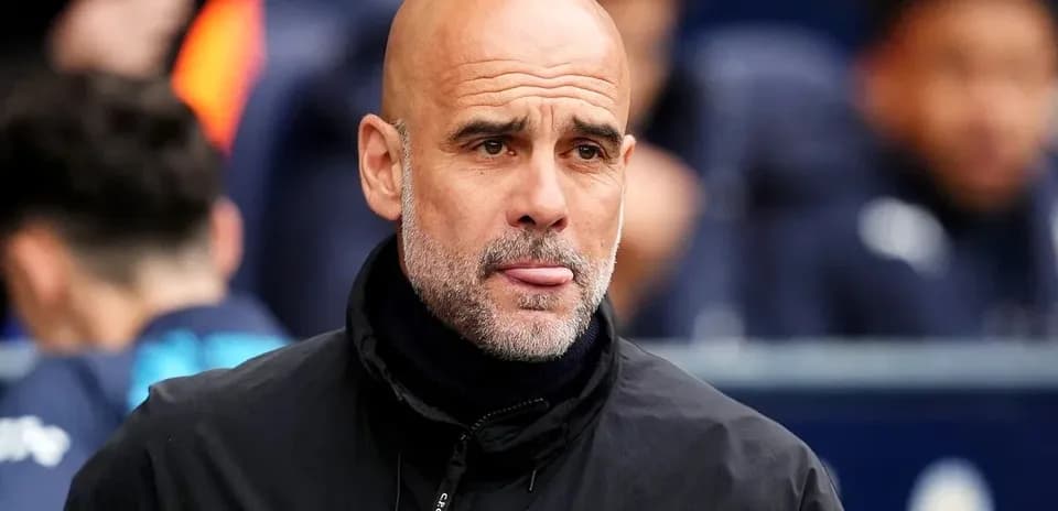 Men's football coach on the sidelines during match