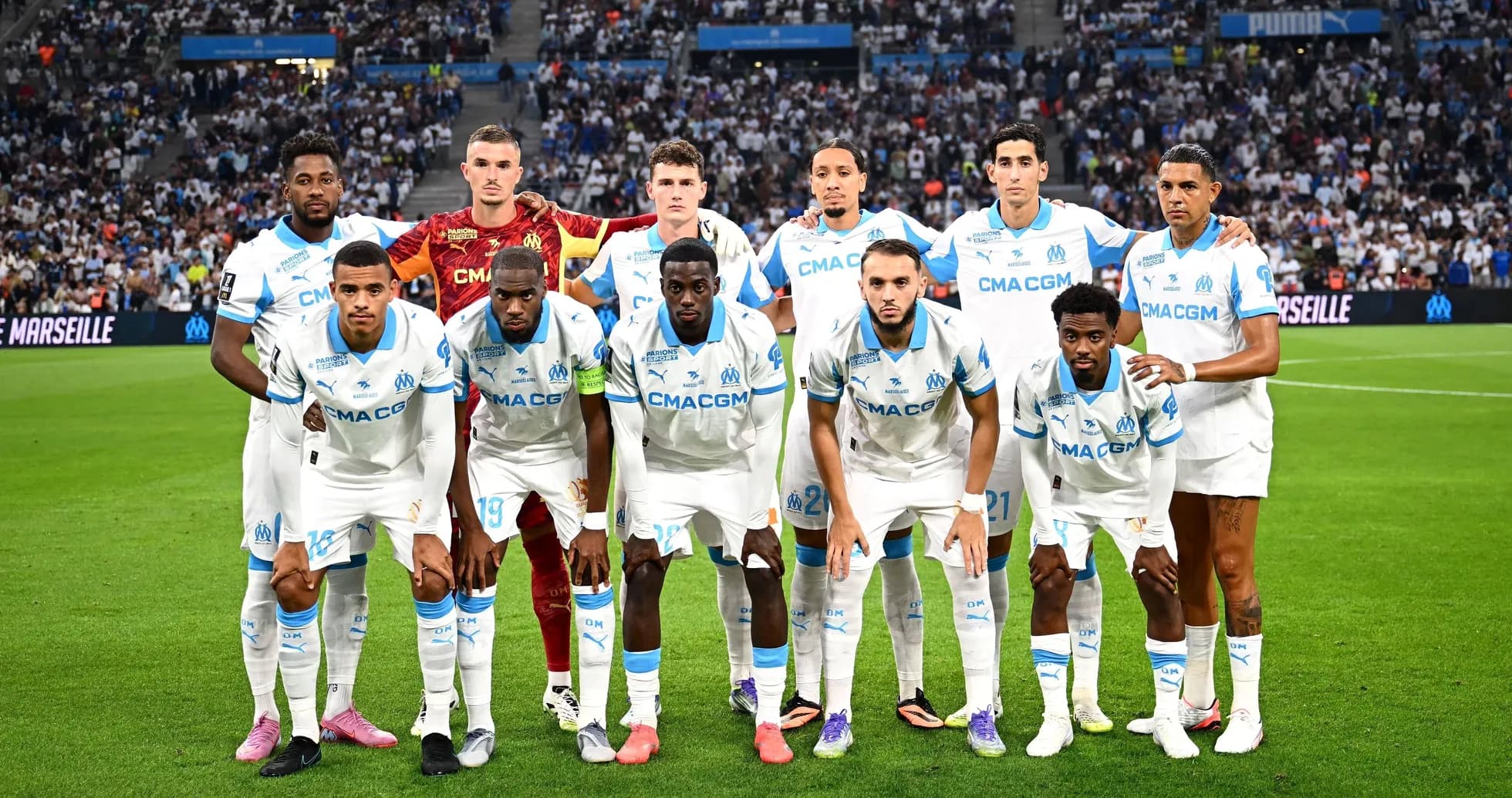 Marseille team posing on the field before match