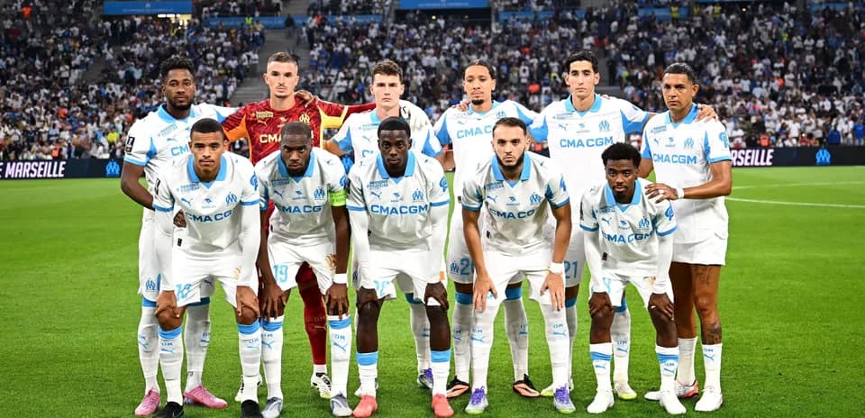 Marseille team posing on the field before match
