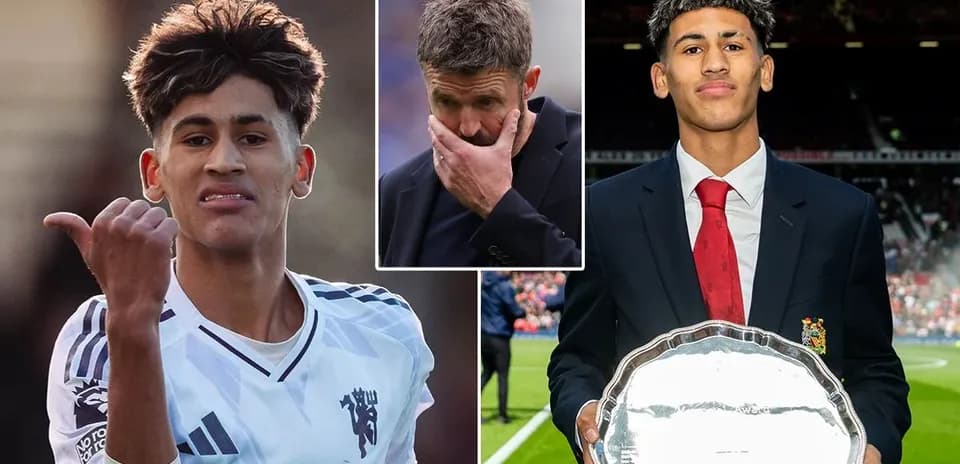 Young footballer celebrating with trophy and coach concerned