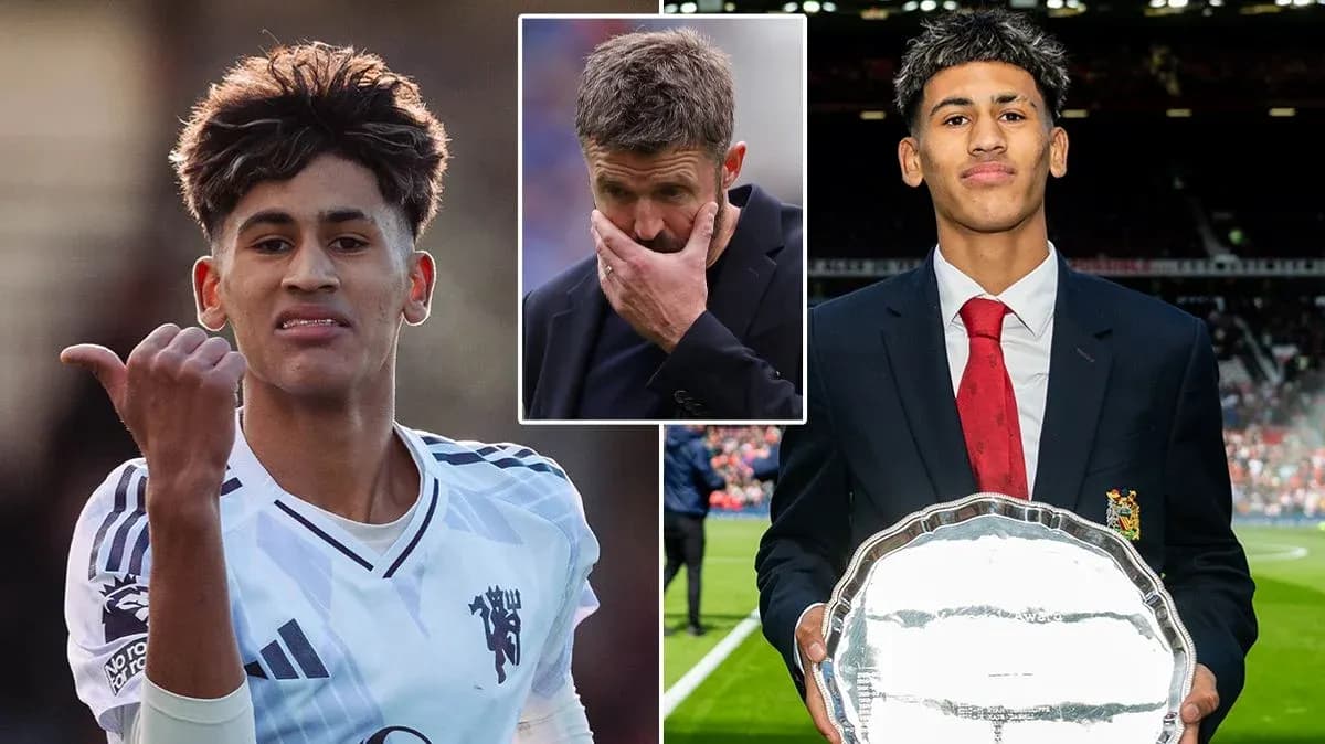 Young footballer celebrating with trophy and coach concerned