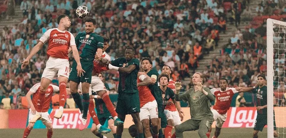 Players competing for the ball during corner kick