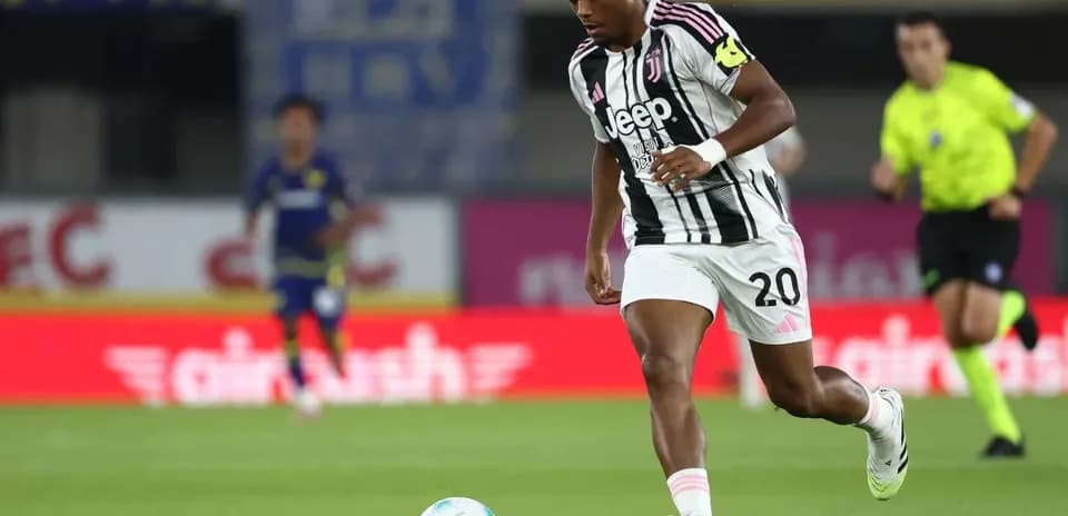 Juventus player running with ball during match