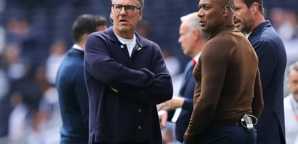 Coaches discussing on the sidelines before match