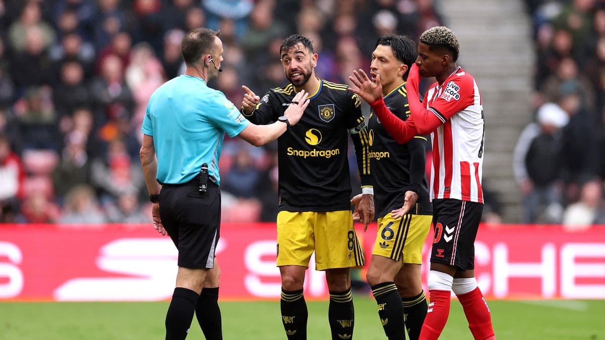 Players arguing with referee during a match