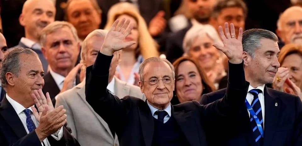 Crowd applauding with a man waving in front