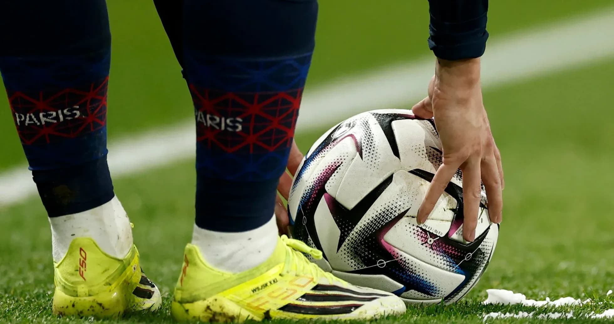 Player placing ball on pitch before kick