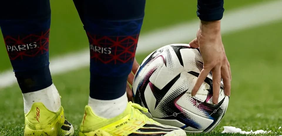 Player placing ball on pitch before kick
