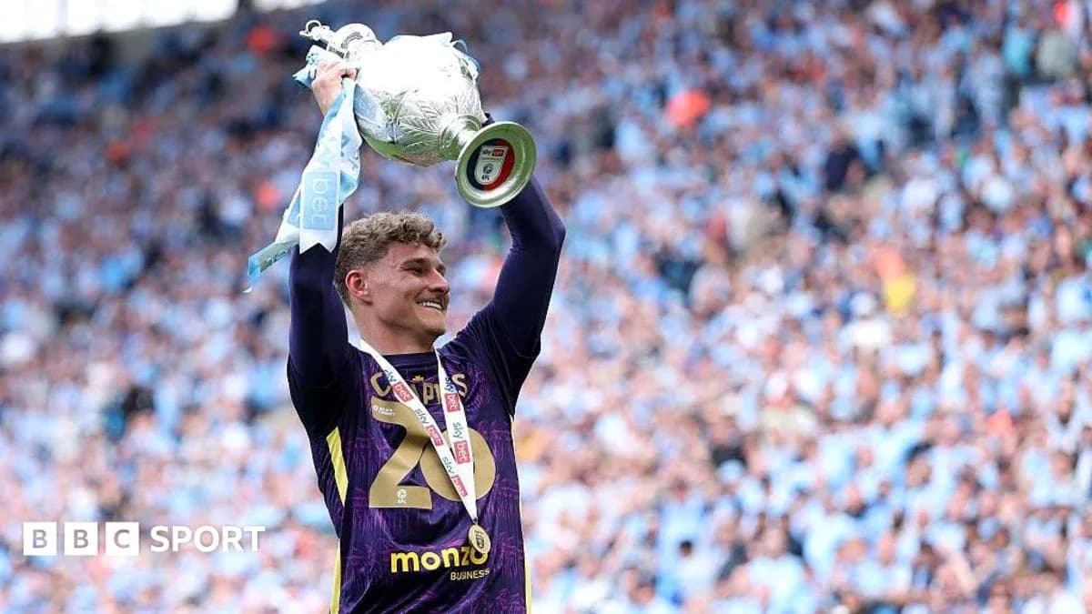 Player celebrating with trophy after winning match