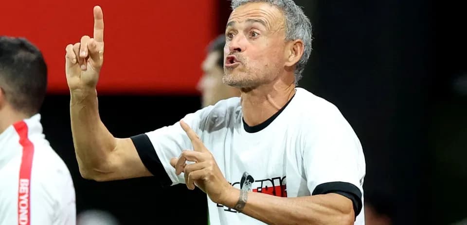 Coach giving instructions on the sidelines during match
