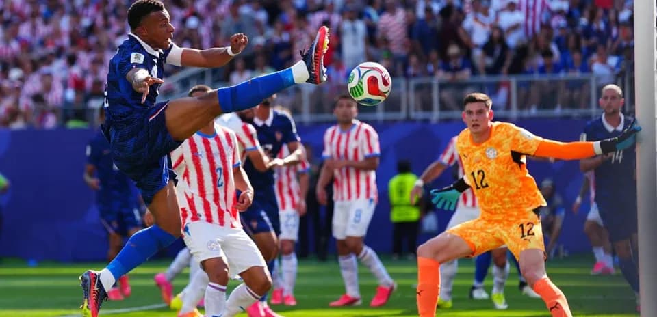 Kylian Mbappé kicking the ball during match