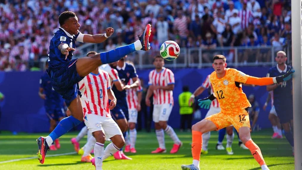 Kylian Mbappé kicking the ball during match