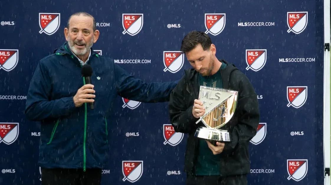 Lionel Messi holding MLS trophy during award ceremony