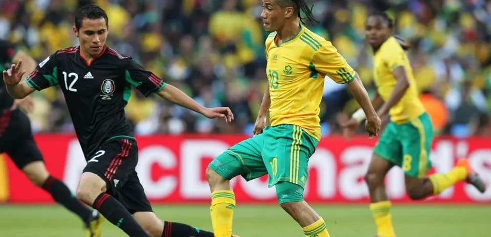 South Africa and Mexico players competing for the ball